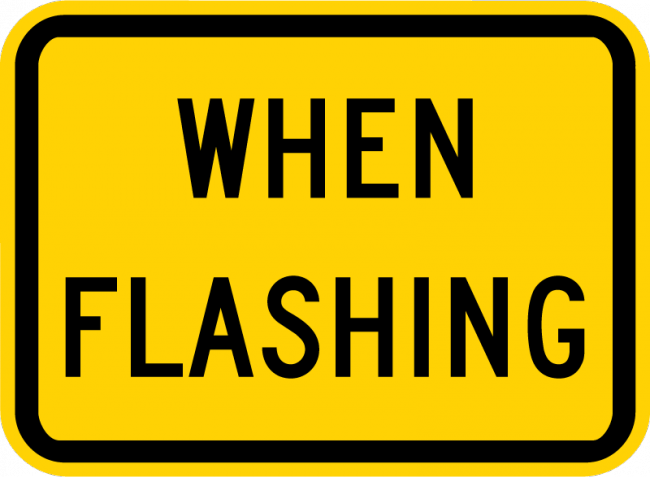 W16-13P-When Flashing (plaque) - Municipal Supply & Sign Co.