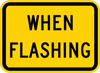 W16-13P-When Flashing (plaque) - Municipal Supply & Sign Co.